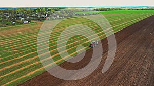 Rural Landscape. Tractor Plowing Field In Spring Season. Beginning Of Agricultural Spring Season. Cultivator Pulled By A