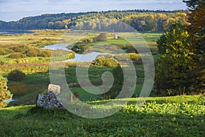 Rural landscape with views  the windmill  river and fields. Pushkin Hills with Savkina Gorka. Russia Pskov region in early