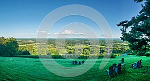 Rural landscape with vineyard and rolling hills in clear sky