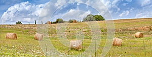 Rural landscapes of Tuscany Italy. Bales and haystacks on the hills and fields