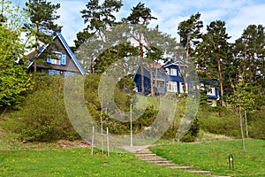 Rural lodges among trees. Nida, Lithuania