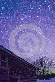 Rural Log Cabin barn at night with stars and milky way