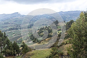 Rural mountainous landscape; fields in Aquitania, Colombia, near Lake Tota photo