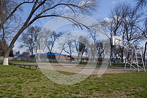 Rural old asphalted basketball court