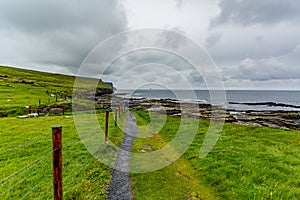 Rural path from Doolin to the Cliffs of Moher along the spectacular coastal route walk