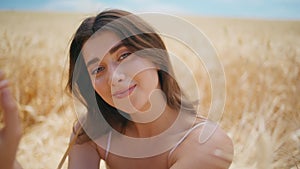 Rural portrait beautiful woman in summer rye field. Smiling young lady posing