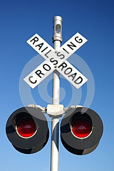 Rural rail road crossing sign with lamps