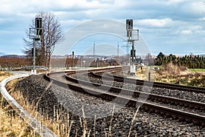 Rural railroad tracks, no catenary, with signaling system