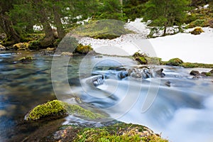 Rural river with motion of flowing water