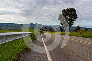 Rural road ahead to the mountain