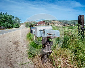 Rural road with a barn and mail boxes