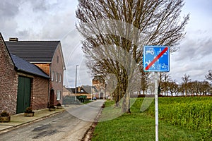 Rural road for cars with traffic sign indicating: prohibited for tractors, bicycles, horses, scooters and pedestrians