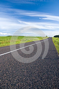 Rural road and cloudy sky