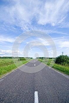 Rural road and cloudy sky
