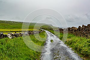 Rural road between the Irish countryside from Doolin to the Cliffs of Moher