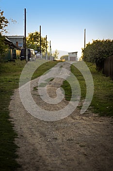 Rural road through the village in Russia