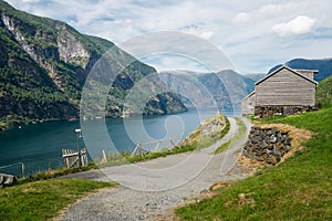 rural road and wooden buildings at Flam village Aurlandsfjord