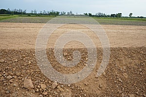 Rural roads in the countryside are surrounded by fields