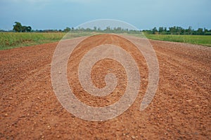 Rural roads in the countryside are surrounded by fields