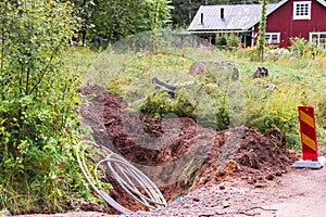 Rural scene with fiber optic cables laid in a trench