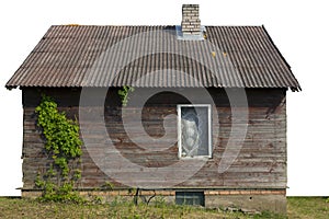 Rural shed with one window and wild grapes