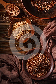 Rural still life with top view of the buckwheat flakes and the peeled groats of buckwheat