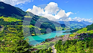 Rural Swiss Scenery from Train Ride Window View, Picturesque Picture as a Painting of Lungern Village and Lake