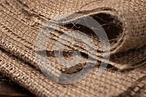 Rural texture of sackcloth. Background of very coarse, rough fabric woven made of flax, jute or hemp. Burlap bag material. Design
