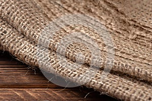 Rural texture of sackcloth. Background of very coarse, rough fabric woven made of flax, jute or hemp. Burlap bag material. Design