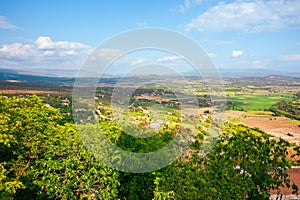 Rural view of cultivated fields and village houses in Provence from hilltop at Gordes