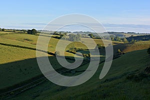 Rural view over valley and green fields