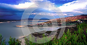 Rural village by the river at dawn