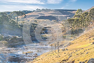 Rural winter landscape with frost at the side river