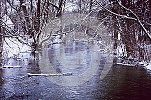 Rural winter landscape, river and snow