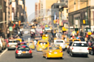 Rush hour with defocused cars and yellow taxi cabs photo