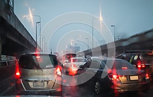 Rush hour after work, Cars stuck and traffic jam in the rain at Pharma 3 road Khlong Toei Bangkok