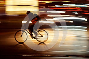 Rushhour with cyclists and pedestrians at night photo