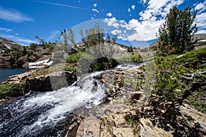 Rushing creek and small waterfall along the 20 Lakes Basin loop trail in California