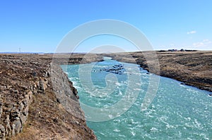 Rushing river through a rocky Icelandic landscape