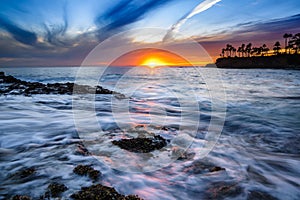 Rushing water and clouds in Laguna Beach, CA