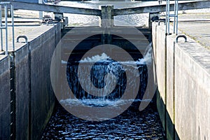 Rushing Water at a Rural Canal Lock Gate