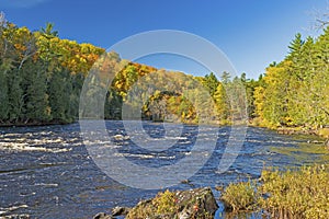 Rushing Waters in the Fall Forest