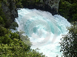 The rushing wild stream of Huka Falls near Lake Taupo, New Zealand.