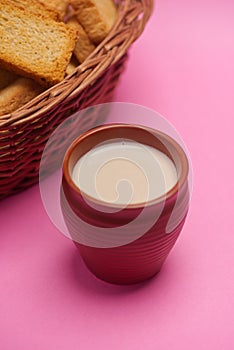 Rusks in a basket and tea in mud glass