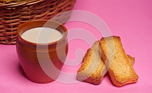 Rusks in a basket and tea in mud glass