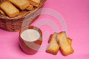 Rusks in a basket and tea in mud glass