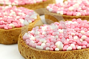 Rusks with white and pink anise seed sprinkles