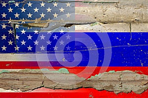 Russia and America flag on old wood.