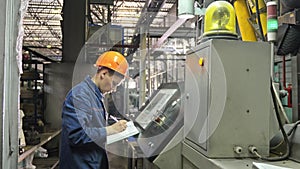 RUSSIA, ANGARSK - JUNE 8, 2018: Operator monitors control panel of production line. Manufacture of plastic water pipes