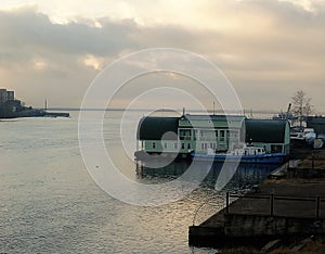 Russia - Arkhangelsk - Northern Dvina river - tug boat near floating landing stage